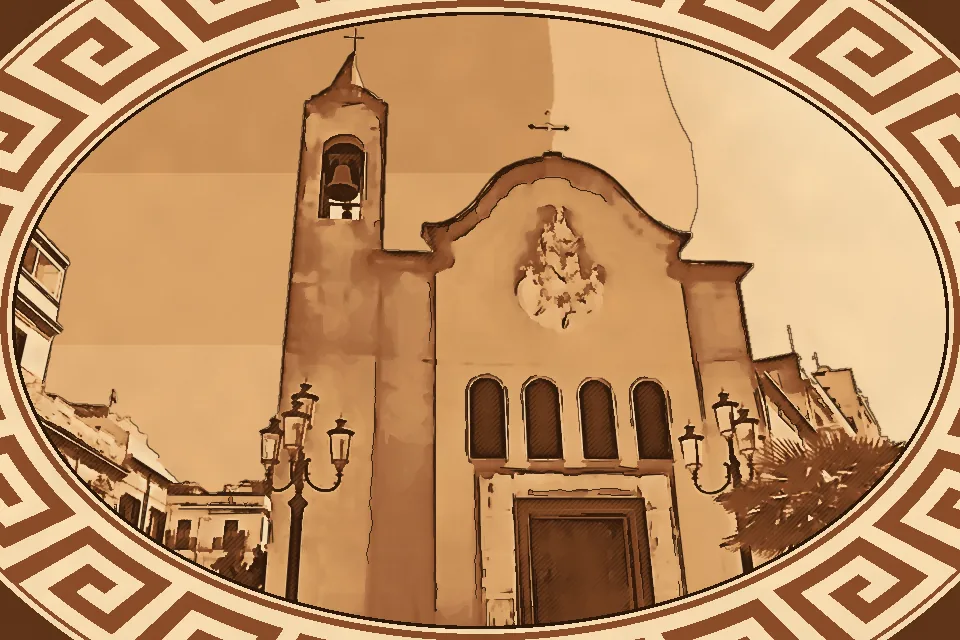Front view of the Church of Our Lady of Mount Carmel in Reggio Calabria under a clear blue sky, showcasing its white classical façade, ornate rose window, bell tower, and surrounding urban architecture with lamp posts and balconies.