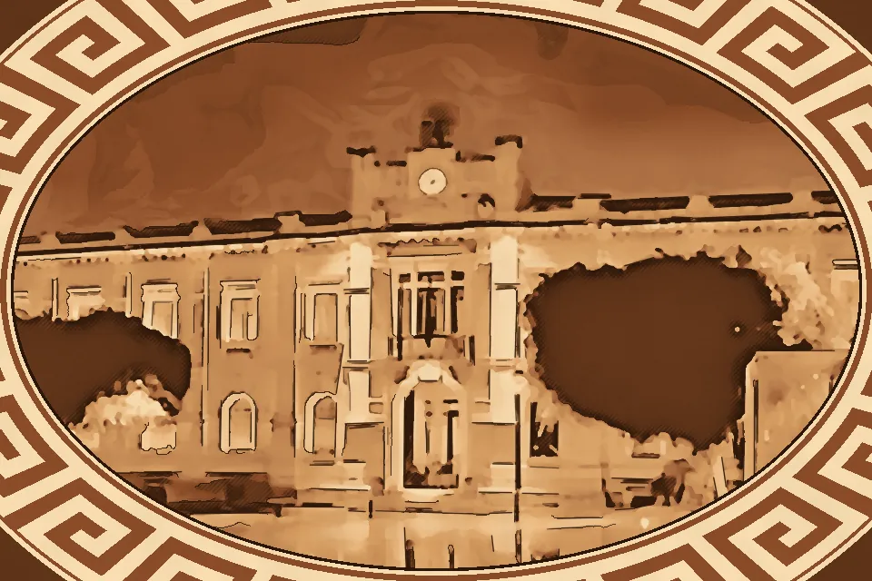 Front view of Palazzo San Giorgio in Reggio Calabria, showing its Art Nouveau Liberty-style façade, arched windows, decorative stonework, and iconic clock tower in Piazza Italia.