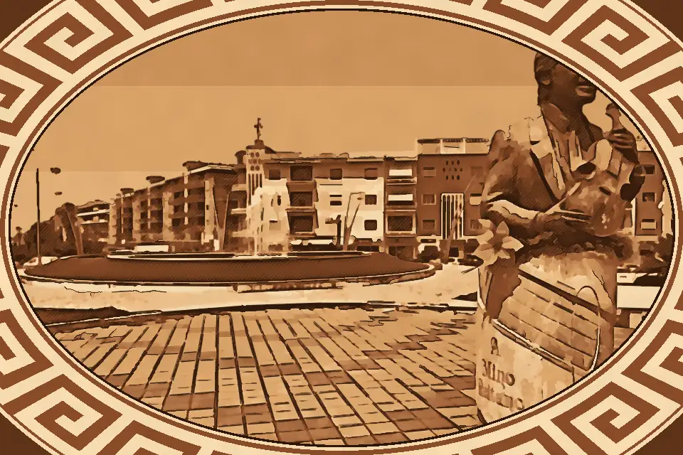 Piazza Mino Reitano in Reggio Calabria with bronze bust of singer Mino Reitano, central fountain, and sunlit urban square surrounded by historic buildings.