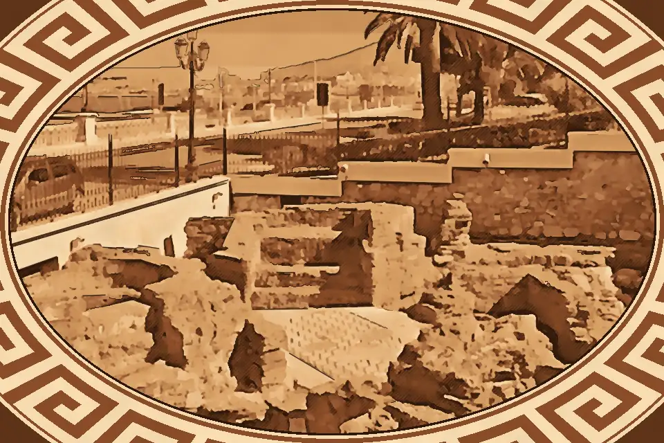 Black and white geometric mosaic floor inside the Roman Baths Reggio Calabria, featuring elongated hexagons and diamond patterns from the 2nd to 3rd century AD.