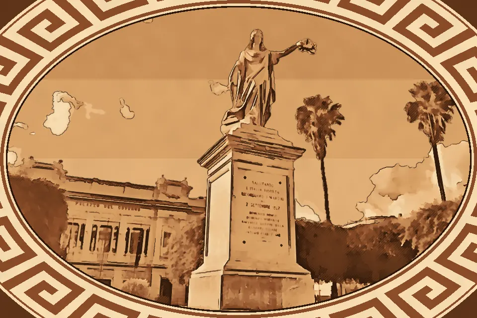 Monument to Vittorio Emanuele II in Reggio Calabria featuring the white marble statue of Italia Turrita with raised sword in Piazza Italia under a blue sky and palm trees.