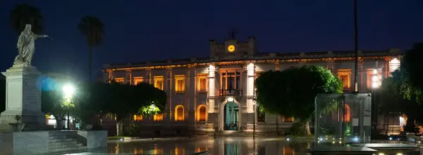 Front view of Palazzo San Giorgio in Reggio Calabria, showing its Art Nouveau façade and clock tower.