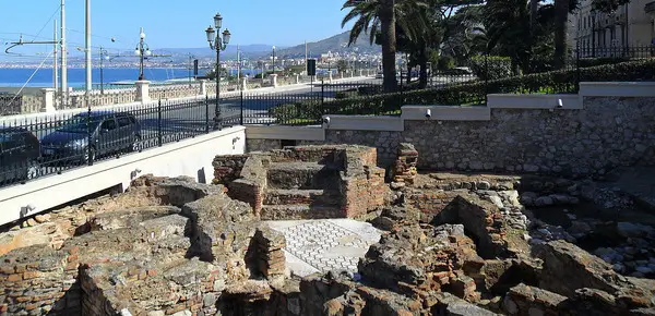Ancient Roman mosaic floor with black and white geometric patterns in Reggio Calabria.
