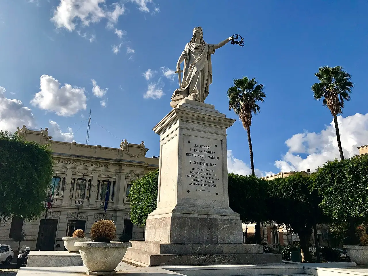 Statue of Italia Turrita holding a sword and laurel crown in Piazza Italia, Reggio Calabria.